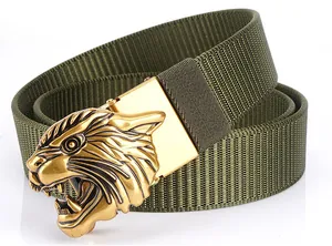 Detailed close-up of golden tiger head buckle on green tactical nylon belt strap