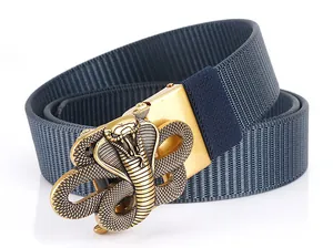 Detailed macro shot of the golden cobra buckle on a navy blue nylon braided belt