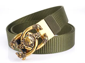 Close-up of golden wolf head metal buckle and army green nylon canvas tactical belt