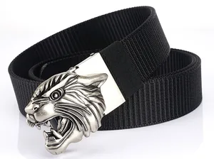 Close-up of tactical nylon belt with vintage silver tiger head buckle and rugged texture