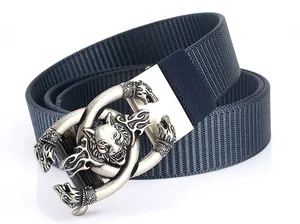 Close-up of silver wolf head embossed buckle on navy blue heavy-duty nylon web belt