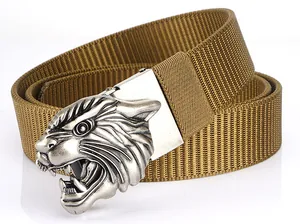 Detailed close-up of a silver tiger head alloy buckle on a thick coyote tan nylon belt