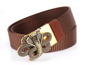 Detail of a brown nylon tactical belt with a golden 3D cobra buckle against white backdrop