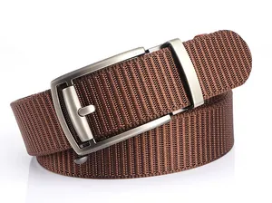 Detail of a brown nylon outdoor belt showing diagonal texture and matte automatic buckle