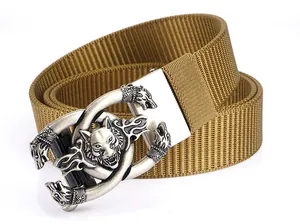 Detailed view of the khaki nylon tactical belt with a metallic wolf head buckle design