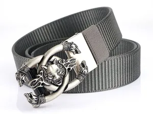 Detail view of the heavy-duty nylon web belt featuring a vintage silver wolf head buckle
