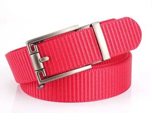 Close-up of bright red nylon woven belt texture with brushed metal automatic buckle