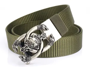 Tactical olive green nylon belt featuring a detailed wolf head buckle in vintage silver