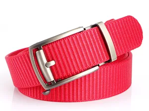 Detail of red tactical nylon belt with brushed metal automatic buckle and woven texture