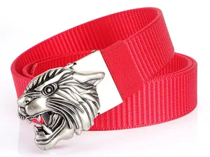 Macro detail of red woven nylon tactical belt with a silver tiger head metal buckle