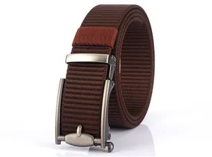 Detail of a brown woven nylon belt featuring a matte silver automatic metal buckle