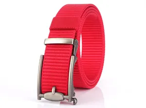 Detail of red nylon woven belt featuring a matte metal automatic buckle on white backdrop