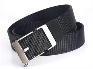 Close-up of black nylon belt with brushed silver buckle on a clean white background