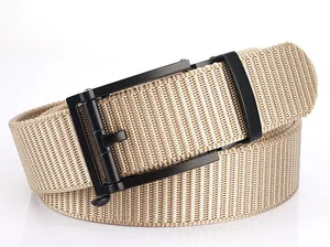 Detail of khaki nylon webbed belt featuring a modern matte black automatic buckle