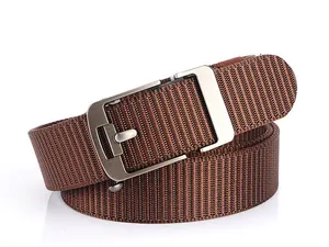 Detail of high-density brown woven nylon belt with brushed silver tactical buckle