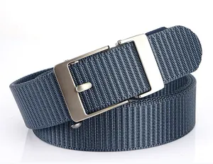 Detailed view of dark blue nylon belt strap with silver matte metal buckle texture