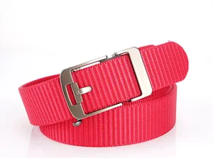 Detail of red woven nylon belt showing high-density texture and brushed silver metal buckle
