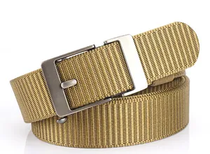 Macro detail of khaki tactical nylon woven belt with brushed metal buckle on white background