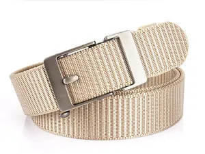 Detailed macro view of khaki nylon web belt with textured matte metal automatic buckle