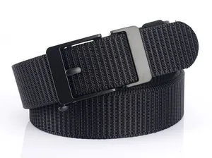 Close-up of tactical nylon web belt with matte black automatic metal buckle on white surface