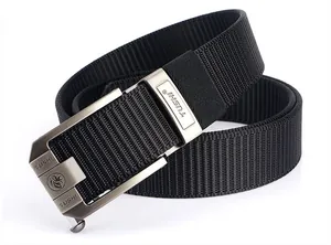 Detail of gray alloy automatic buckle with lion logo and black nylon woven tactical belt