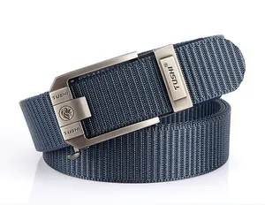 Detailed view of dark blue nylon belt featuring a brushed metal automatic buckle with logo