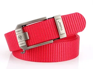 Detail of red thickened nylon belt with matte gunmetal automatic buckle and logo