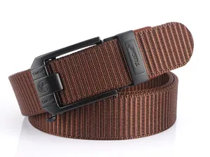 Close-up of the black alloy automatic buckle with embossed lion head on brown nylon belt