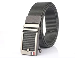 Macro view of nylon woven belt with textured gunmetal automatic buckle and stripes