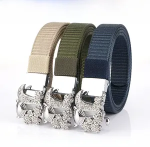Detail of nylon woven belts with crystal-studded zinc alloy fox shaped buckles