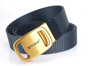 Detail of blue nylon woven belt featuring a premium gold metallic automatic buckle with logo