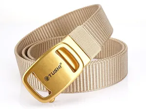 Detail of khaki nylon tactical belt with a golden automatic metal buckle and Tushi logo