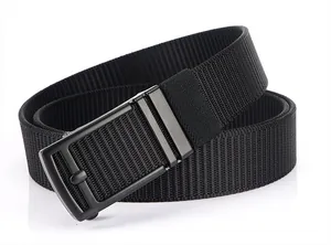 Close-up of black woven nylon belt featuring a matte black rectangular metal buckle