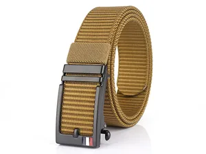 Macro detail of khaki nylon belt with matte black buckle and tricolor accent