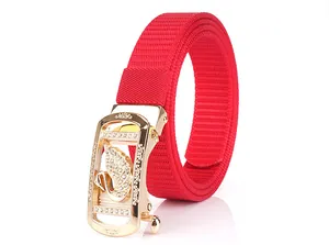 Detail of red nylon belt with golden swan buckle and sparkling rhinestones