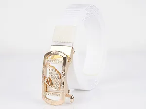 Detail showing white nylon belt with golden automatic buckle featuring swan rhinestone decor
