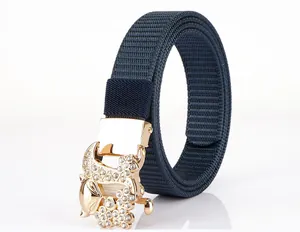 Detailed view of dark blue nylon belt with a crystal-encrusted golden fox buckle closure