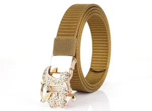 Macro detail of rose gold fox buckle with rhinestones on khaki nylon woven belt