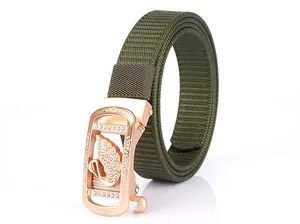 Detailed macro shot of army green nylon belt with rose gold swan buckle and crystals