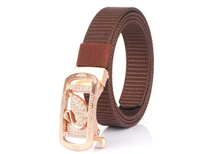Detailed close-up of brown nylon canvas belt with a crystal-encrusted swan automatic buckle