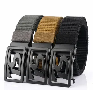 Detailed view of three nylon belts with matte black metal automatic buckles in black and grey