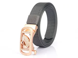 Detailed texture of grey nylon woven strap and rose gold automatic buckle with swan detail
