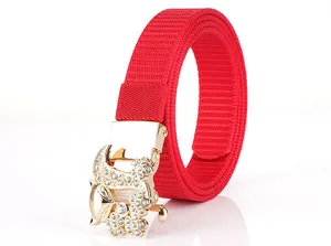 Detailed close-up of a red nylon woven belt with a sparkling gold rhinestone fox buckle