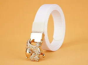 Detail of white nylon belt featuring a gold fox-shaped buckle with sparkling rhinestones