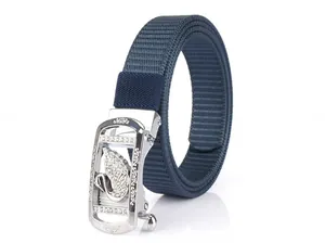 Detail of silver automatic buckle with rhinestone swan on navy nylon woven belt