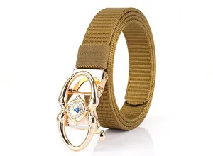 Detail of khaki woven nylon belt with a gold alloy buckle and sparkling crystal inlay