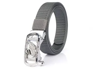 Detail of grey nylon woven belt featuring a silver automatic buckle with rhinestone swan