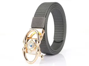 Close-up of grey nylon canvas belt featuring a gold dolphin automatic buckle with crystal