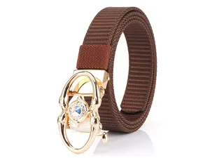 Detailed view of a brown woven nylon belt featuring a gold buckle with sparkling crystals