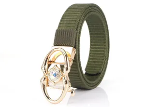 Detail of olive green nylon belt with a golden animal-shaped buckle and inlaid crystals